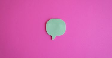 Photo by Jorge Urosa: https://www.pexels.com/photo/a-cutout-of-a-dialogue-box-on-a-pink-surface-9131059/